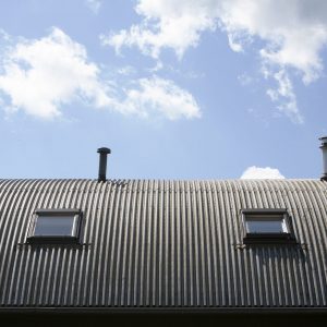 Metal roof with  windows and chimneys